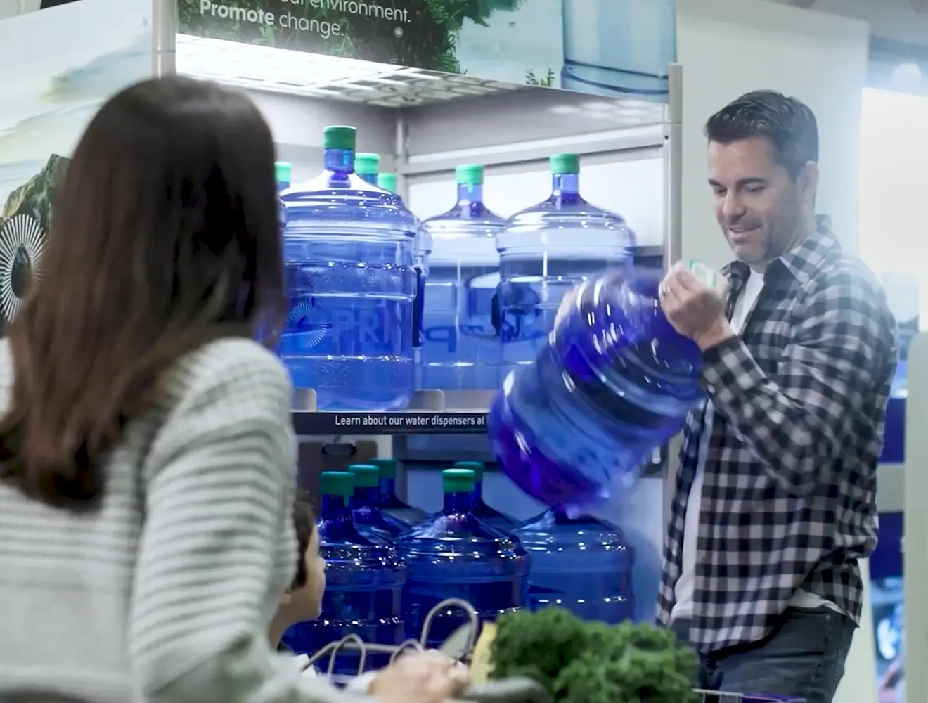 Man exchanging Primo 5 Gallon Water Bottles