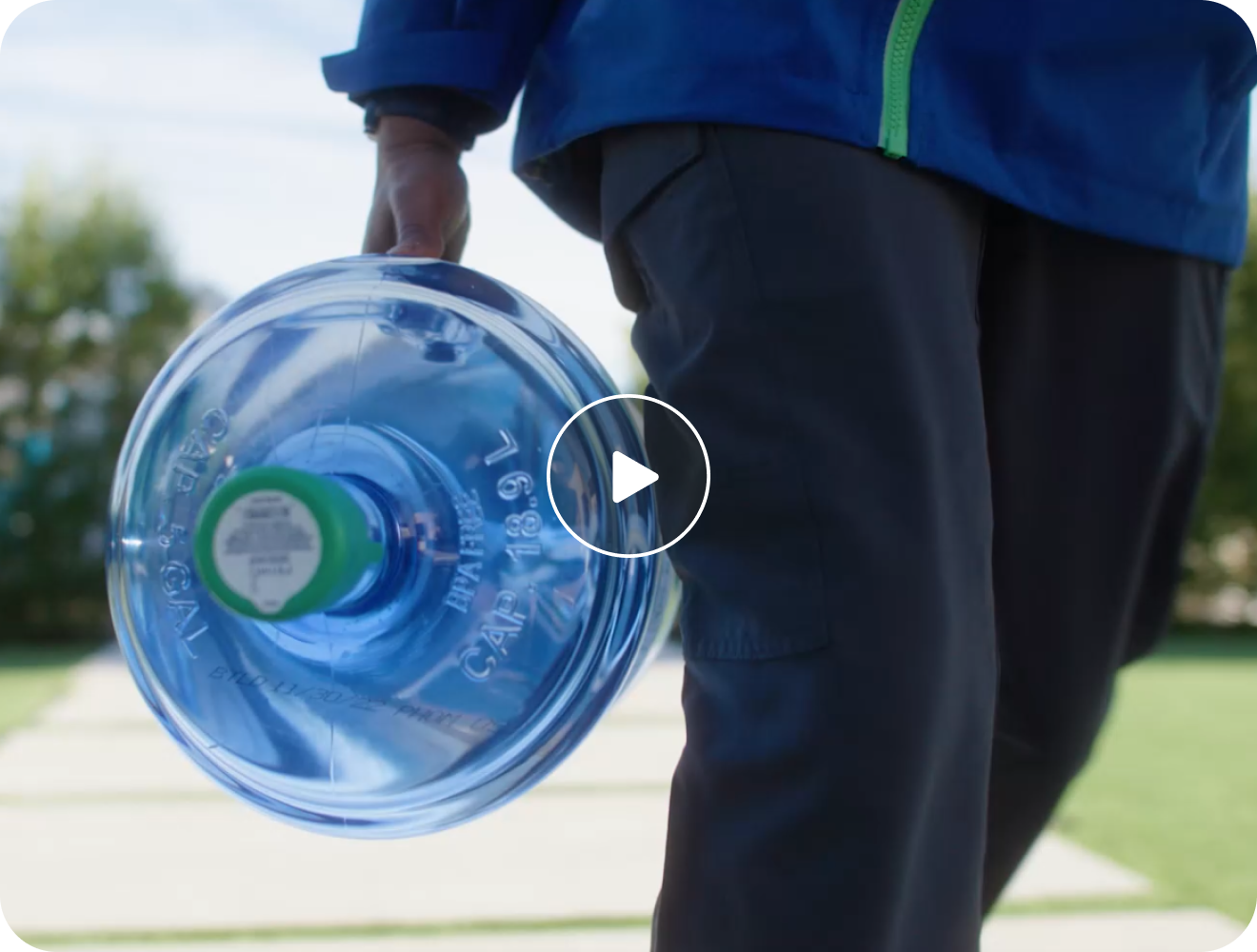 Man carrying a Primo Water bottle