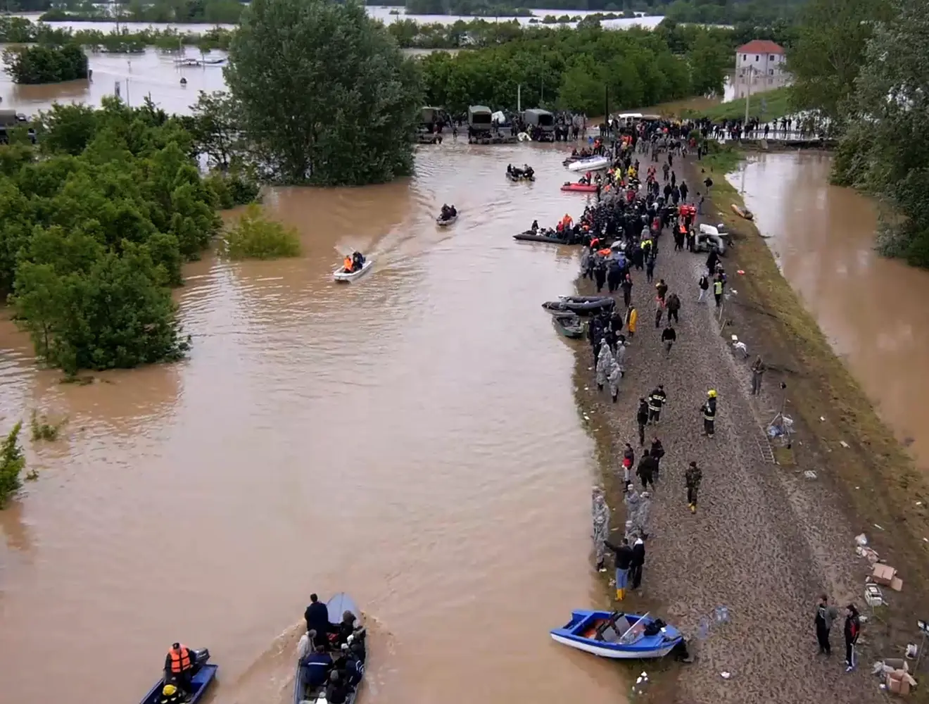 Boats rescuing people during a flood