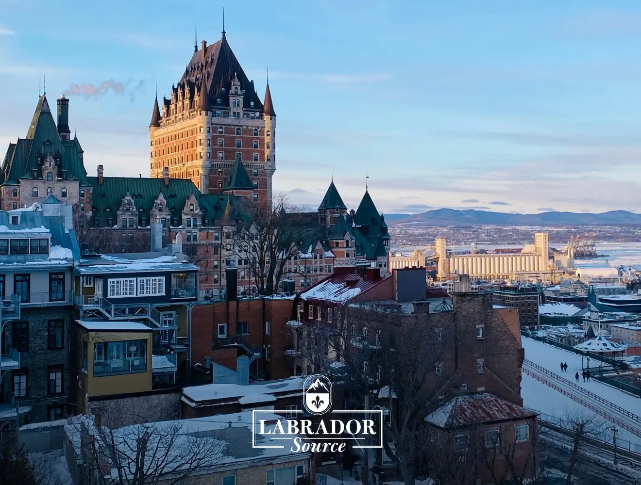 Old Quebec cityscape in winter with Labrador Source logo