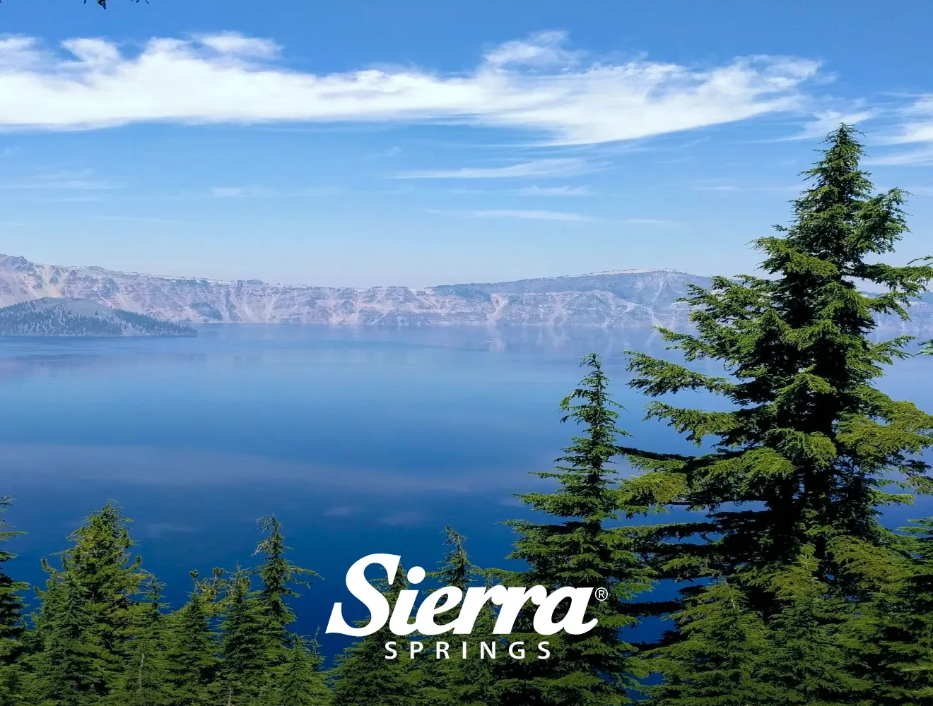 Lake, mountains and trees with Sierra Springs logo