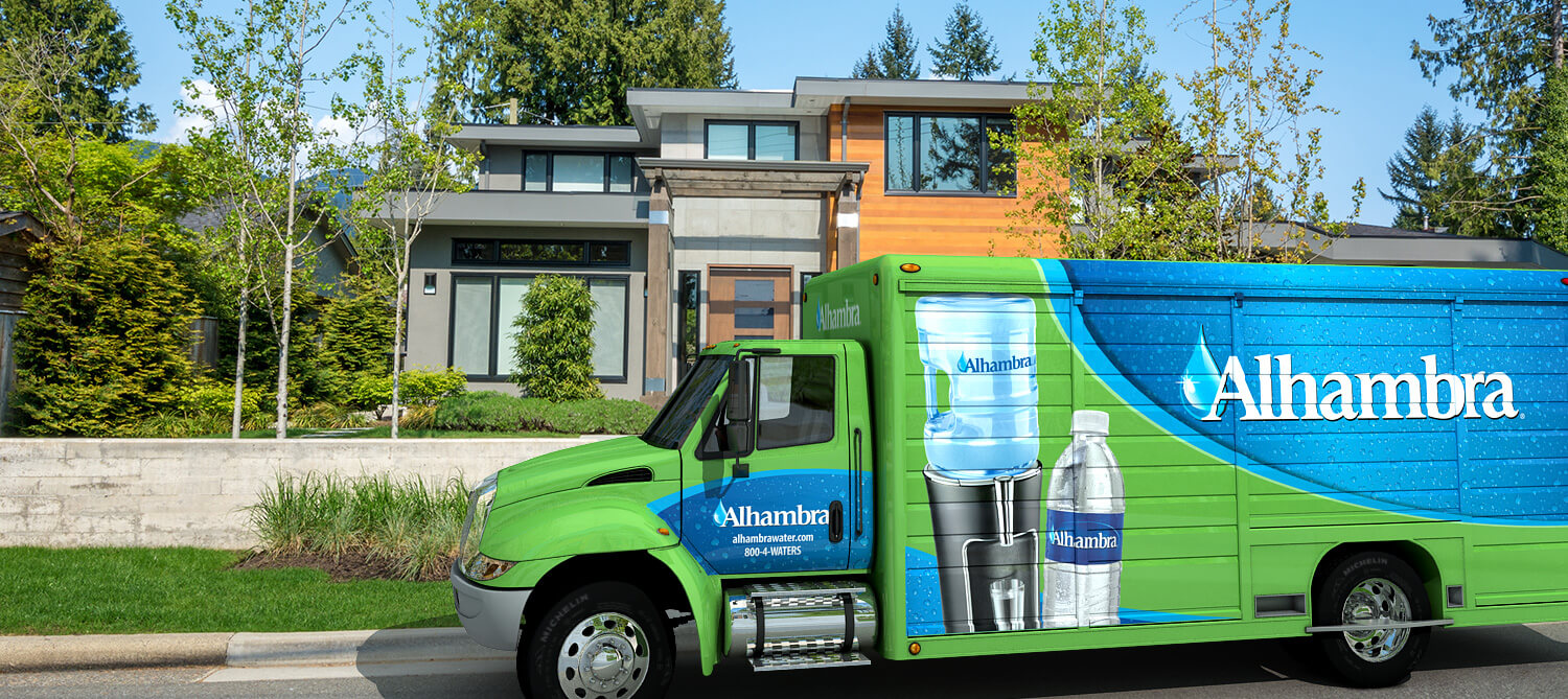 Alhambra Water Delivery Truck delivers to a home